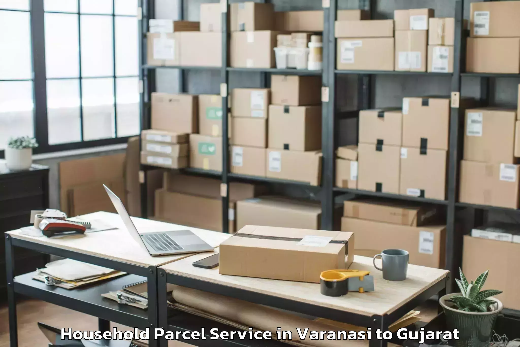 Book Varanasi to Childrens University Gandhinag Household Parcel Online